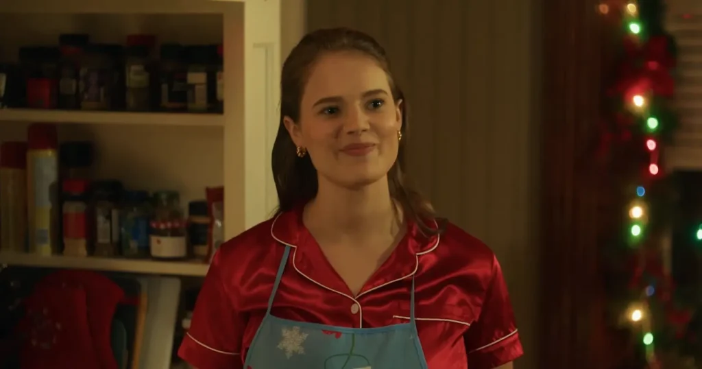 Ellise Roth dressed as a baker named Charlie in A Royal Icing Christmas Movie
