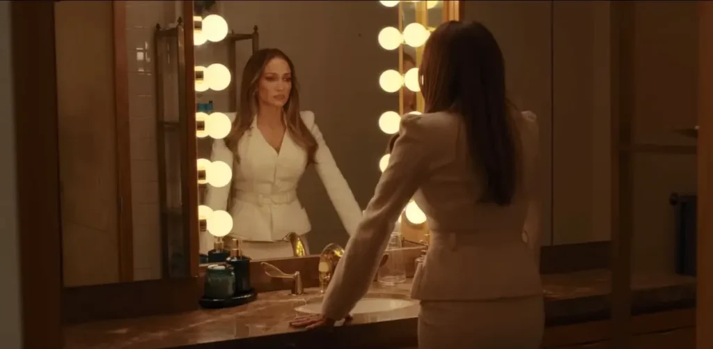 Where was Office Romance filmed? All Filming Locations Explained Office Romance Netflix scene showing Jennifer Lopez as Jackie Cruz looking herself into the mirror