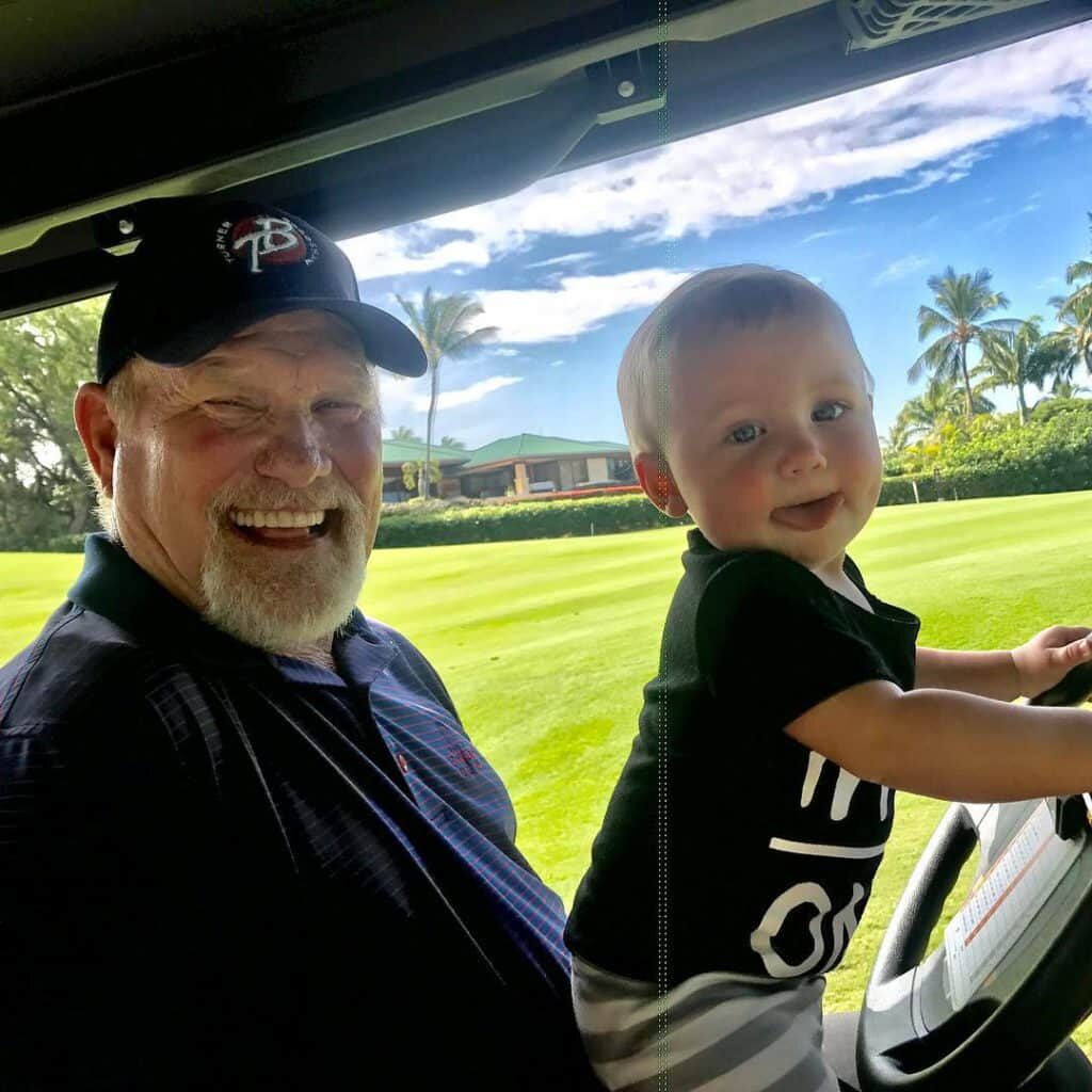 Terry Bradshaw playing with grandchild Jeb Hester