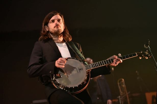 Mumford & Sons lead guitarist slammed by the Internet for being a fan of ‘neo Nazi’ author Andy NGO