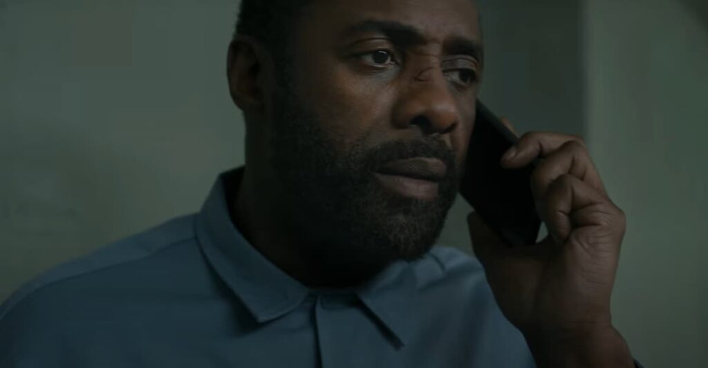 Idris Elba talking on the phone as John Luther in the Luther movie