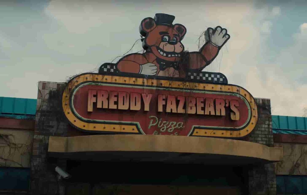 FNAF movie poster featuring Freddy Fazbear's Pizza house