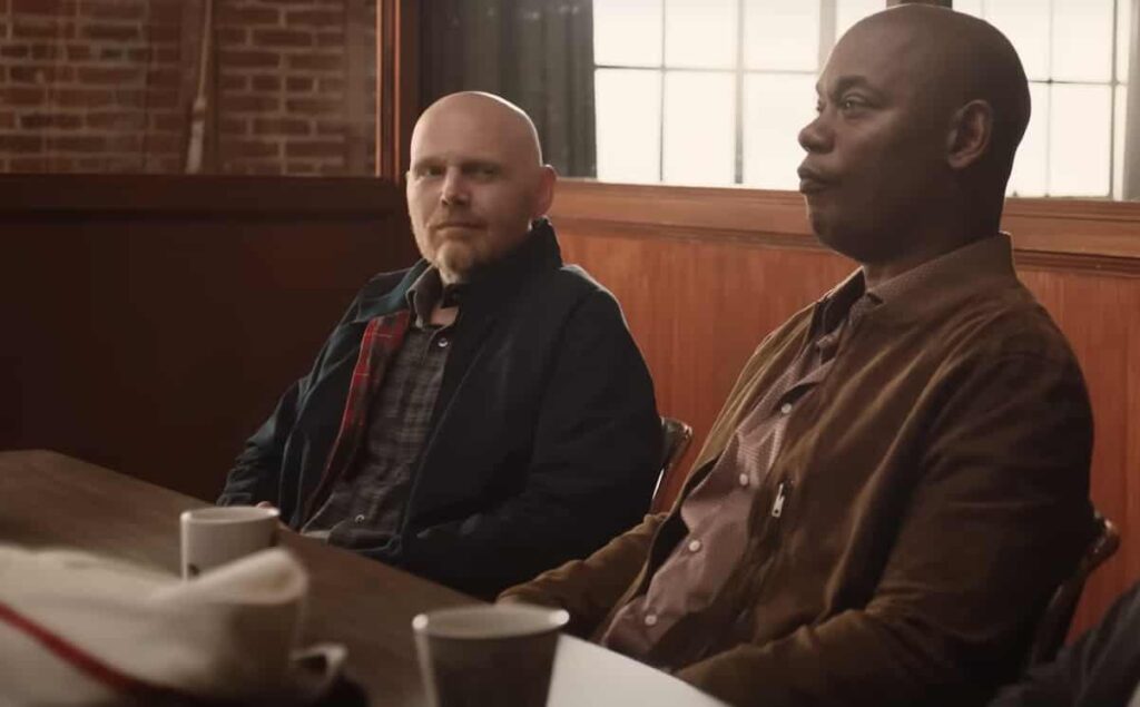 Old Dads movie scene showing Bill Burr as Jack sitting with Bokeem Woodbine as Mike Richards in a bar 