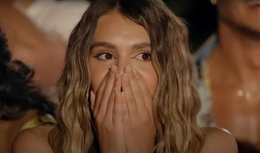a shocked woman contestant in Surviving Paradise series Netflix