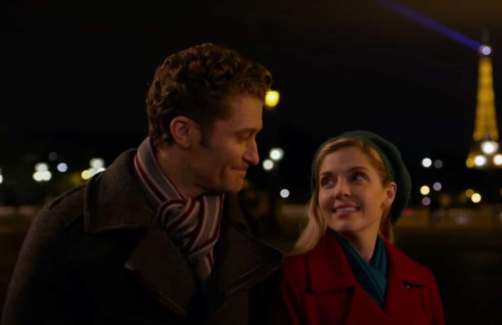 Jen Lilley and Matthew Morrison walking around the Eiffel Tower during the filming of A Paris Christmas Waltz