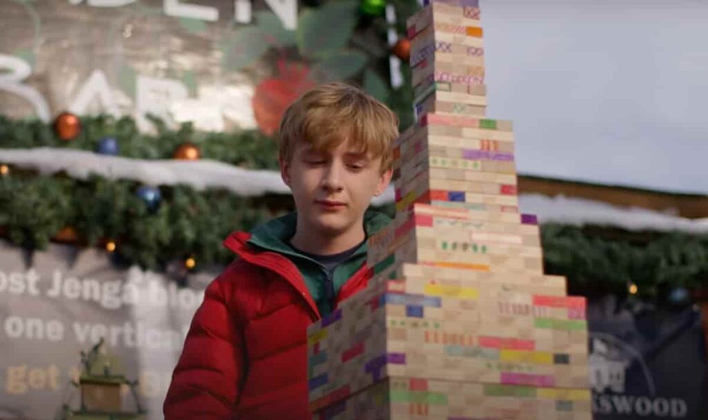 A World Record Christmas showing Aias Dalman as Charlie stacking Jenga blocks