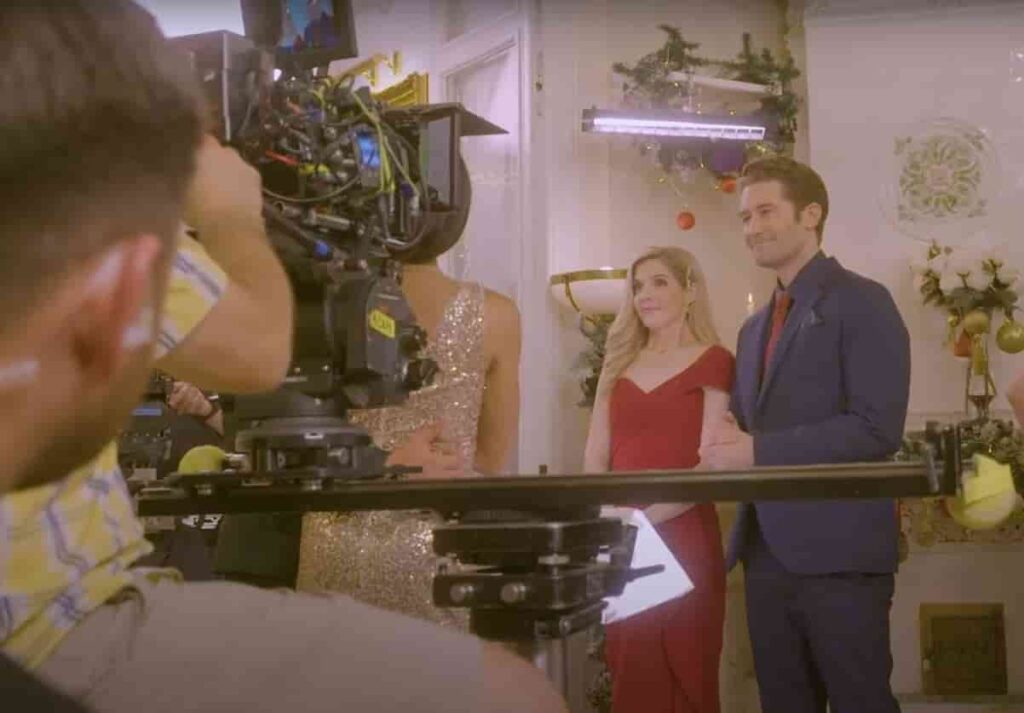 Jen Lilley and Matthew Morrison showcasing A Paris Christmas Waltz behind the scene moments