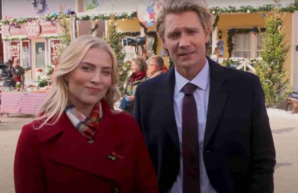 Christa Taylor Brown and Chad Michael Murray on the filming set of Christmas on Windmill Way discussing behind the scenes