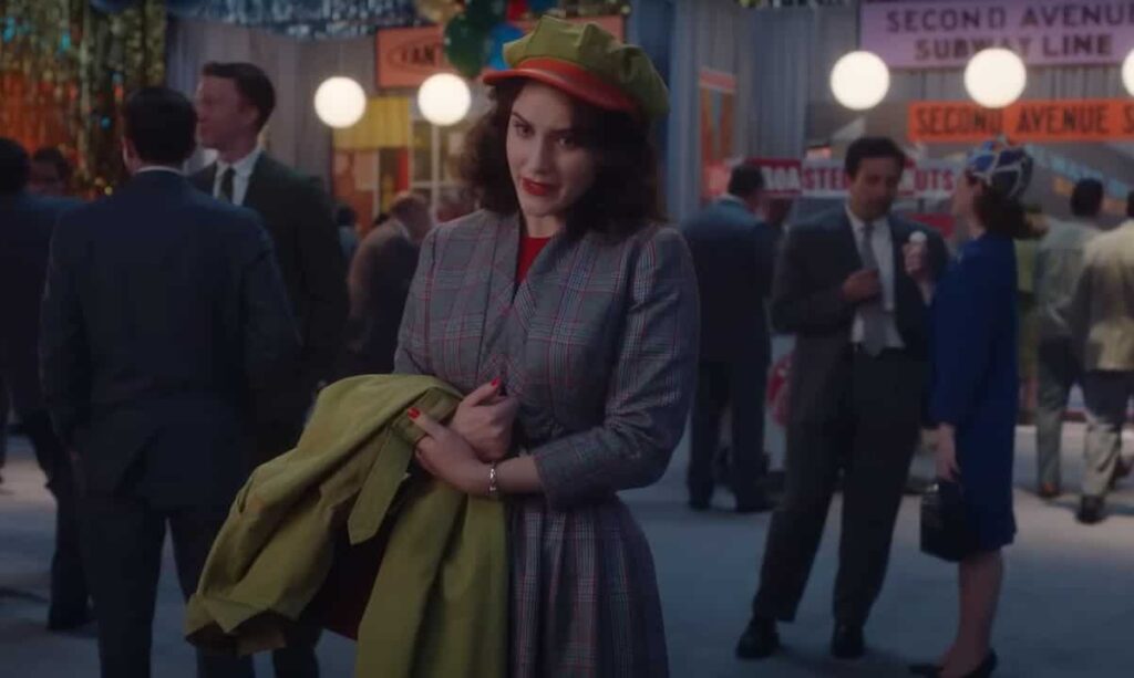 Rachel Brosnahan wearing a winter checkered coat in The Marvelous Mrs. Maisel series